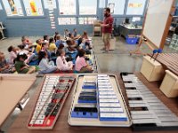 John B. Devalles elementary school music teacher Lee Dias, welcoms second graders to music class for the first time. as students across New Bedford return to school.  [ PETER PEREIRA/THE STANDARD-TIMES/SCMG ]